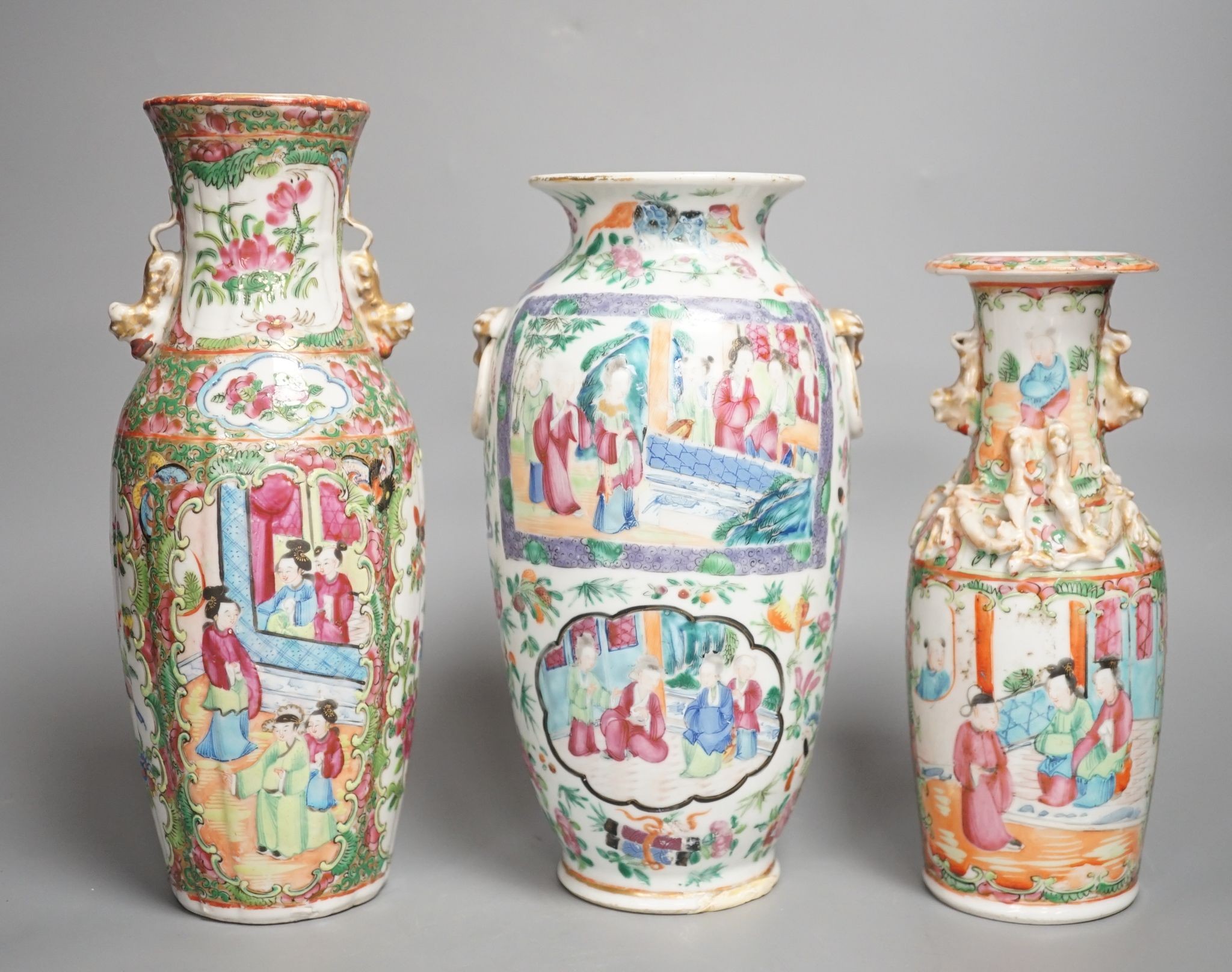 Three 19th century Chinese famille rose vases, Tallest 25 cms high.